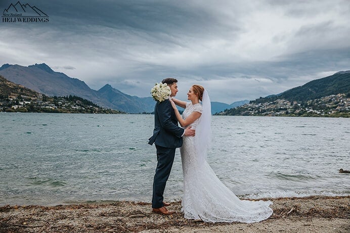 Beautiful wedding couple by the lake in Queenstown