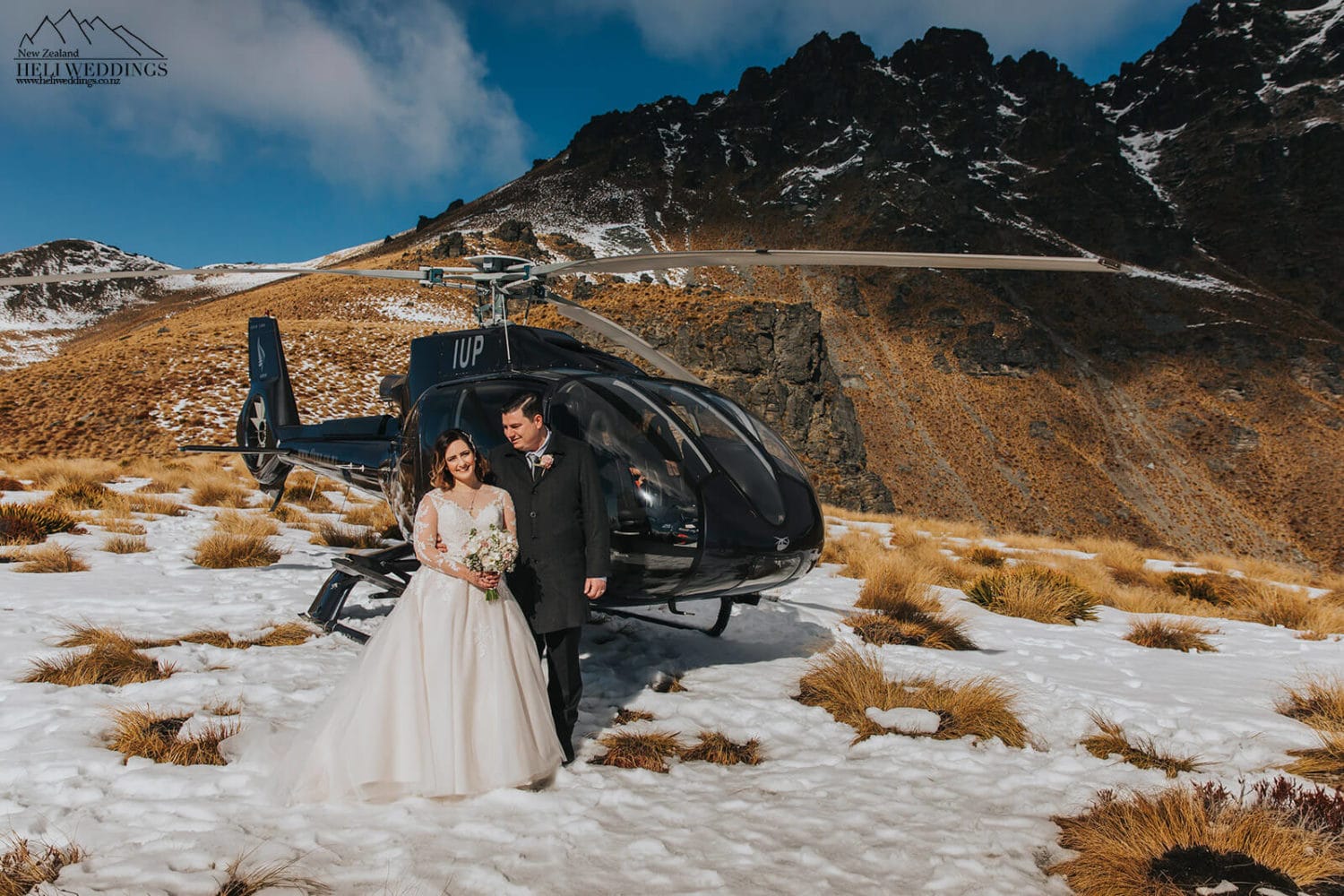 Bride and groom with helicopter in Queenstown
