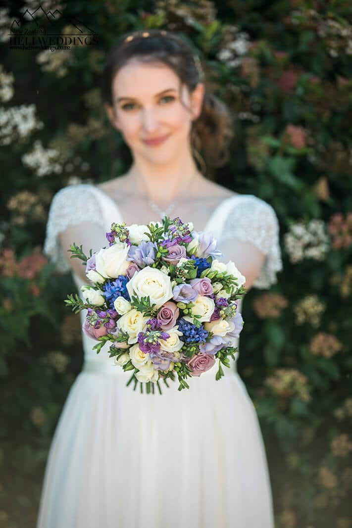 bride with flowers at Stoneridge Estate Queenstown