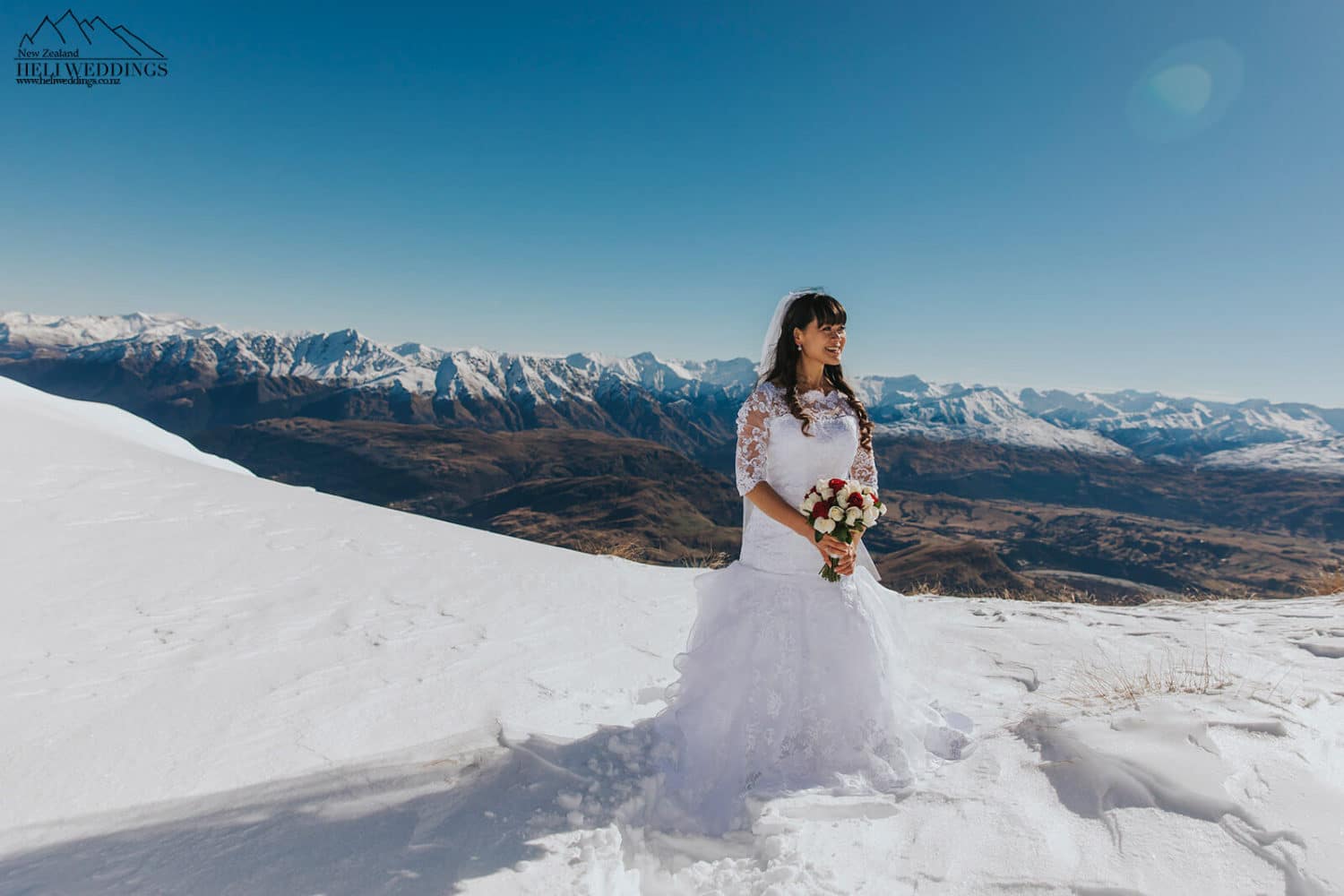 Wedding photos on The Remarkables Queenstown , Snowy winter wedidng