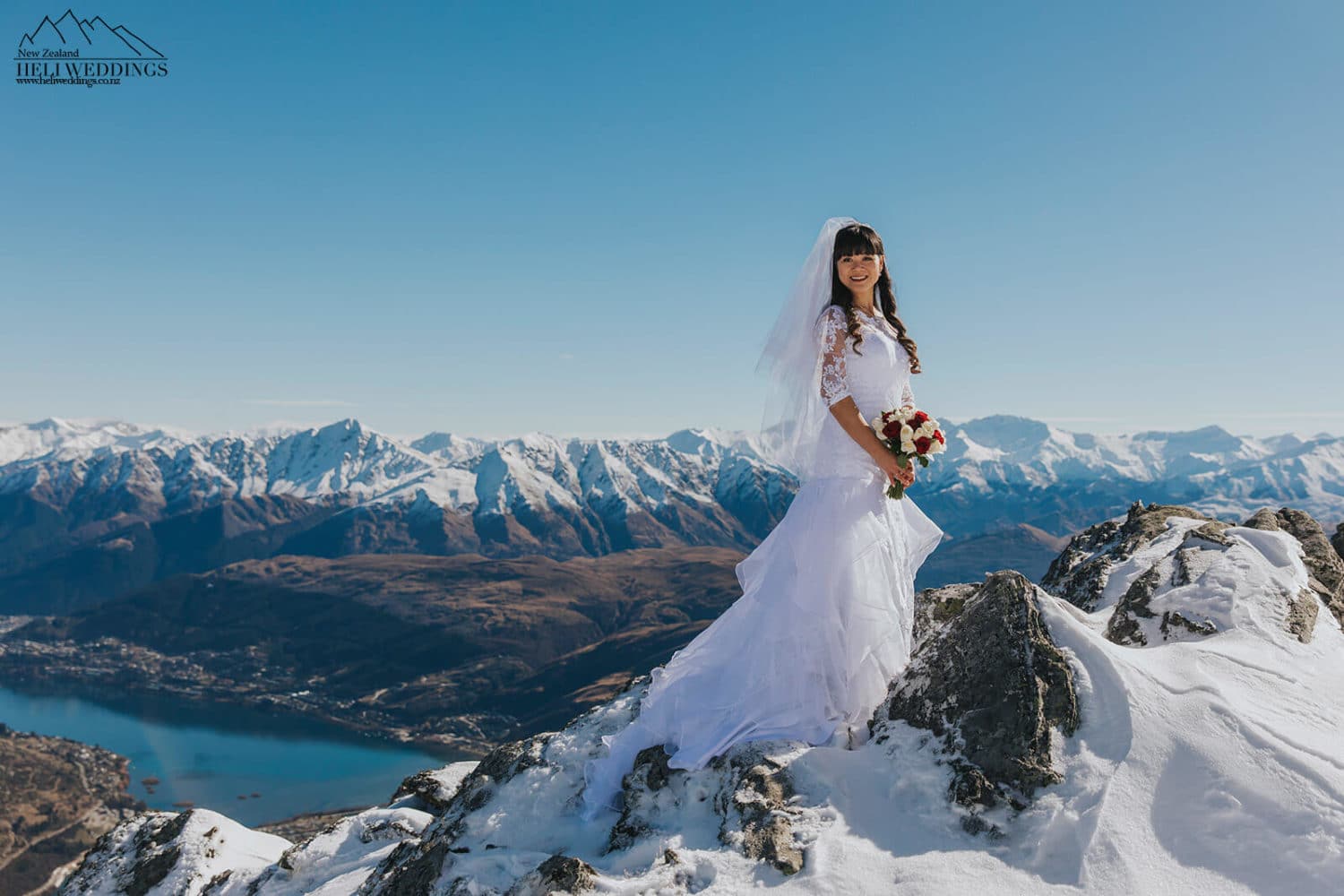Wedding photos on The Remarkables Queenstown , Snowy winter wedidng
