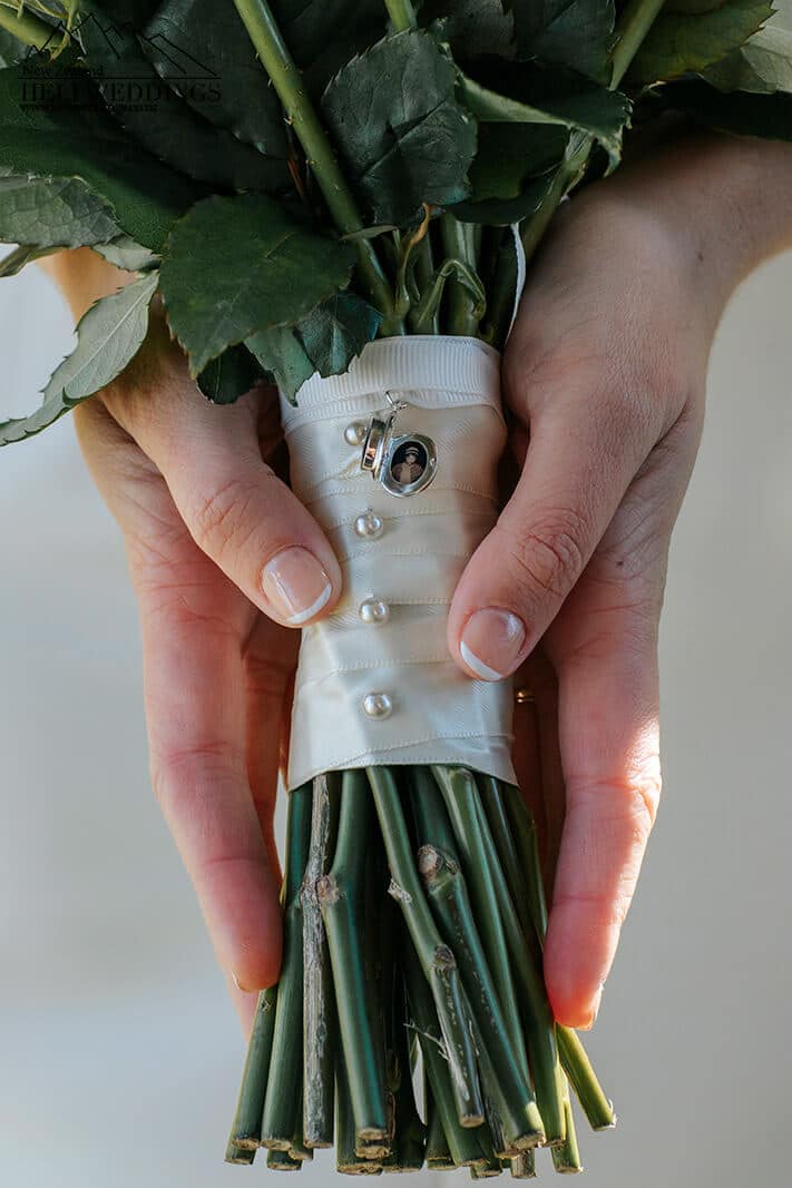 Close up of wedding detail on flower bouquet