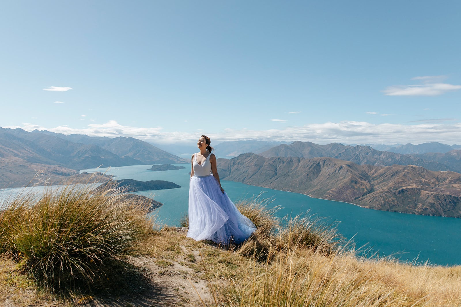 Heli Wedding on Coromandel Peak with a blue dress