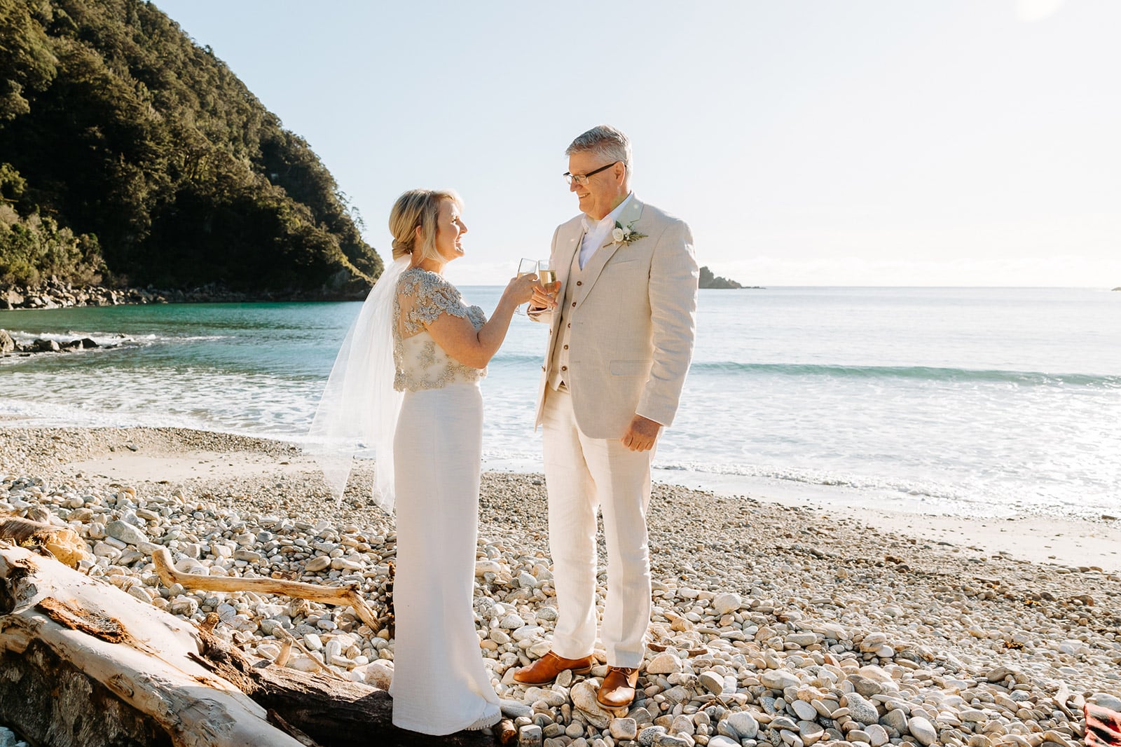 Luxury elopement wedding in Queenstown New Zealand. The Majestic Heli Wedding Beach wedding photos