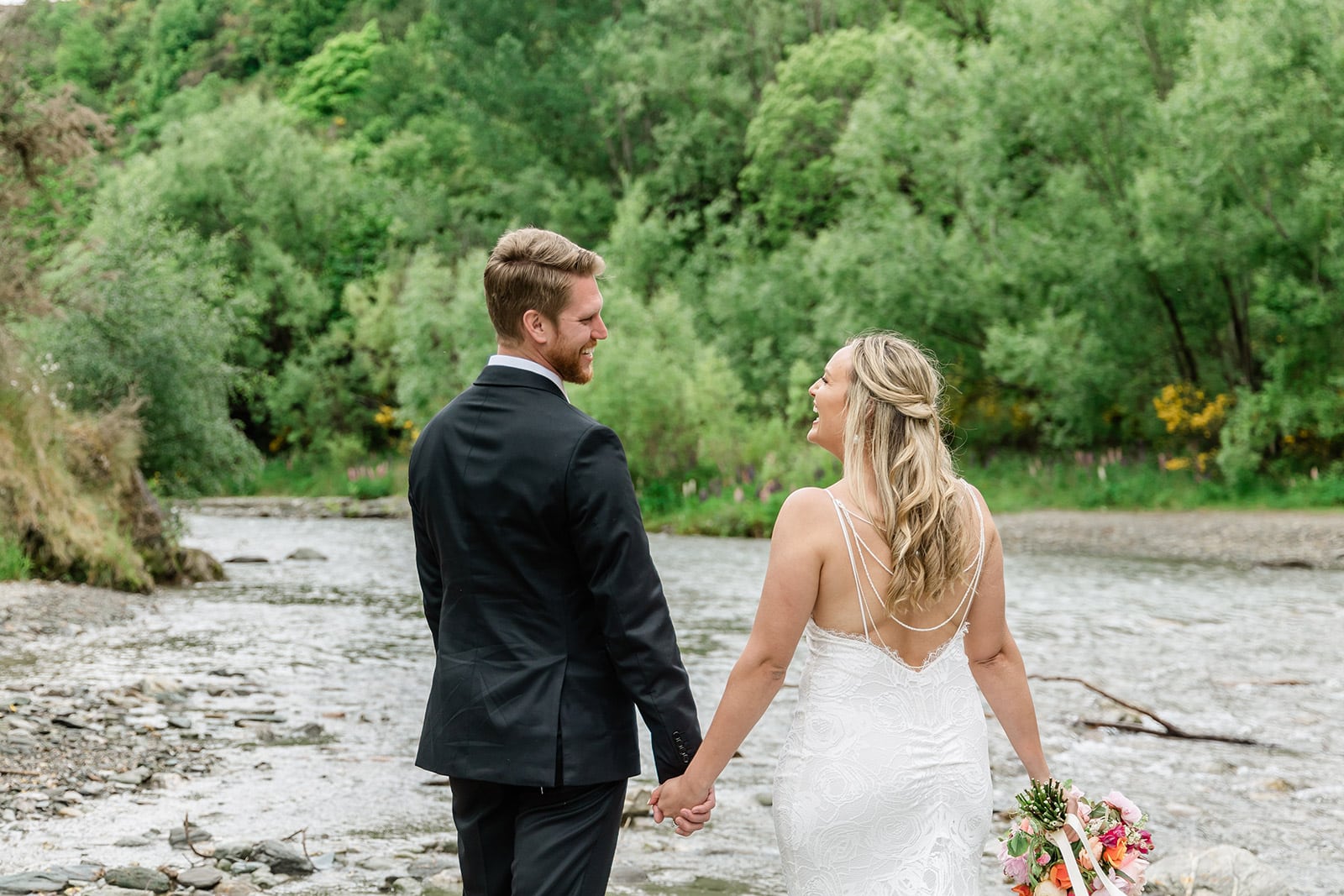 Wedding in Queenstown New Zealand, bride and groom among lupins