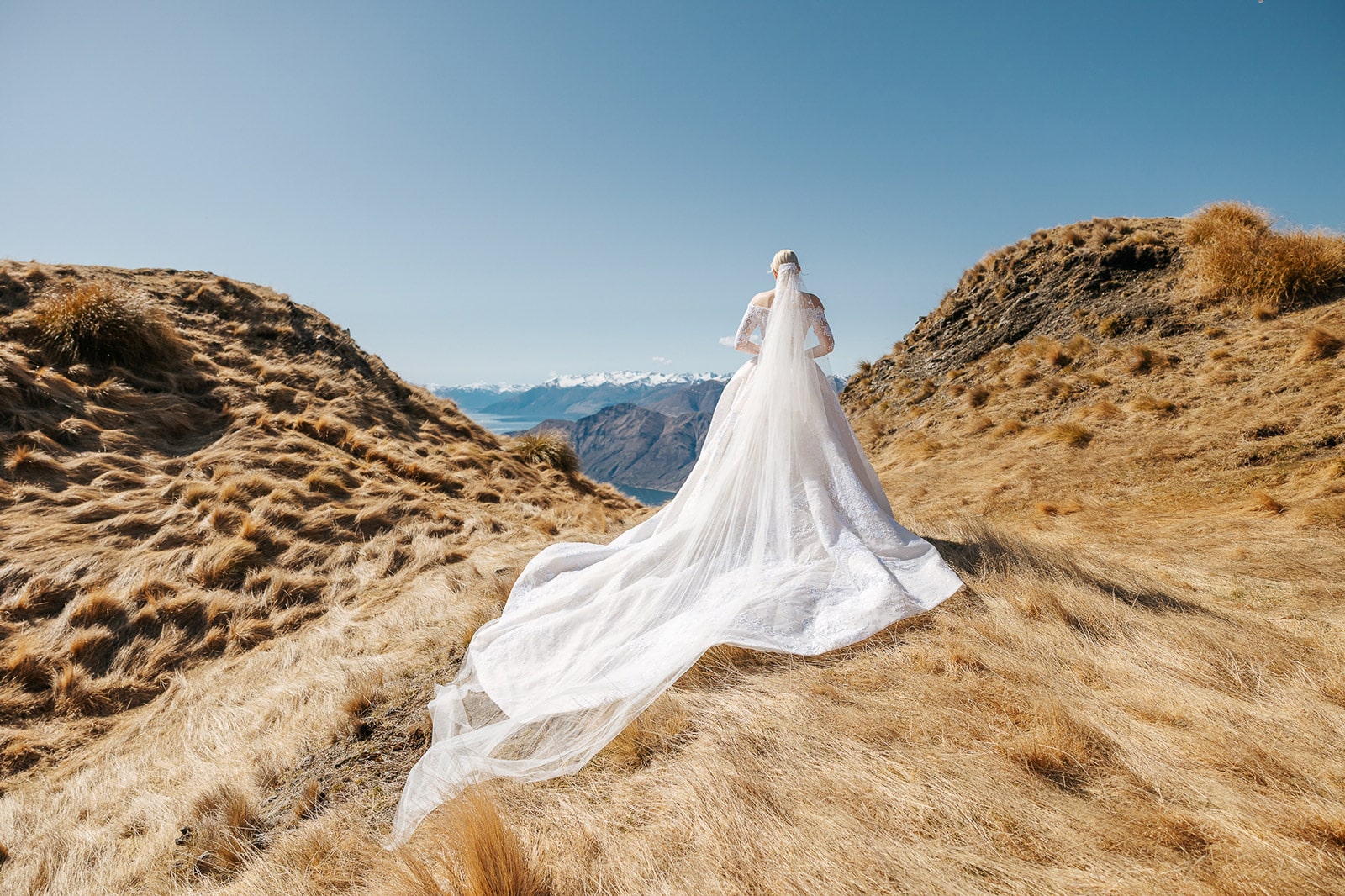 Heli Wedding on Coromandel Peak and Bride wearing a Steven khalil wedding dress at Queenstown Wedding