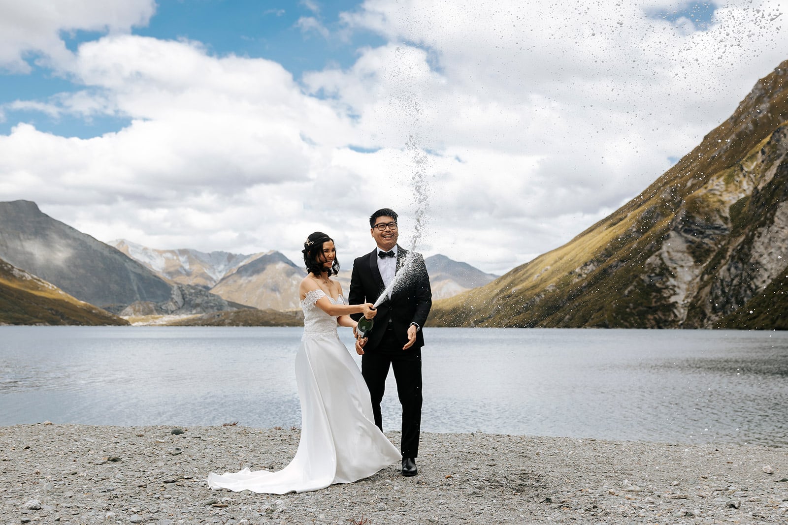 Heli Wedding ceremony at Lochnagar in Queenstown, bride and groom with lake in the background