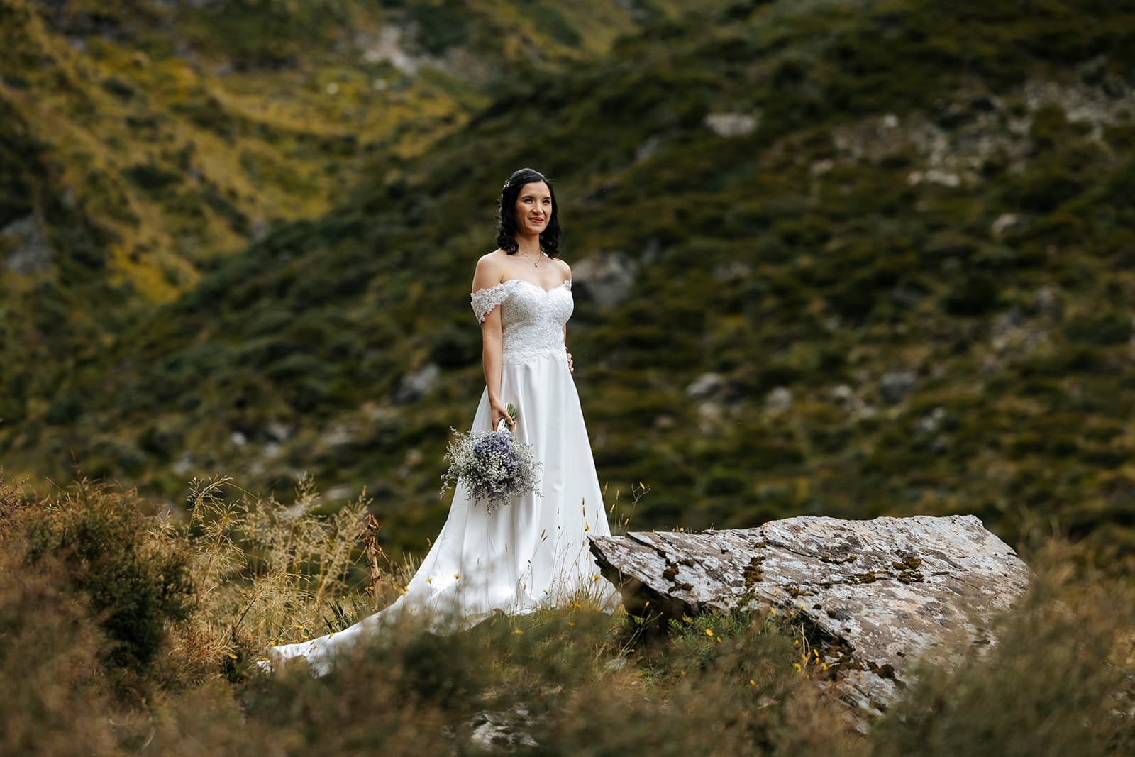 Heli Wedding ceremony at Lochnagar in Queenstown, bride awith waterfall in the background