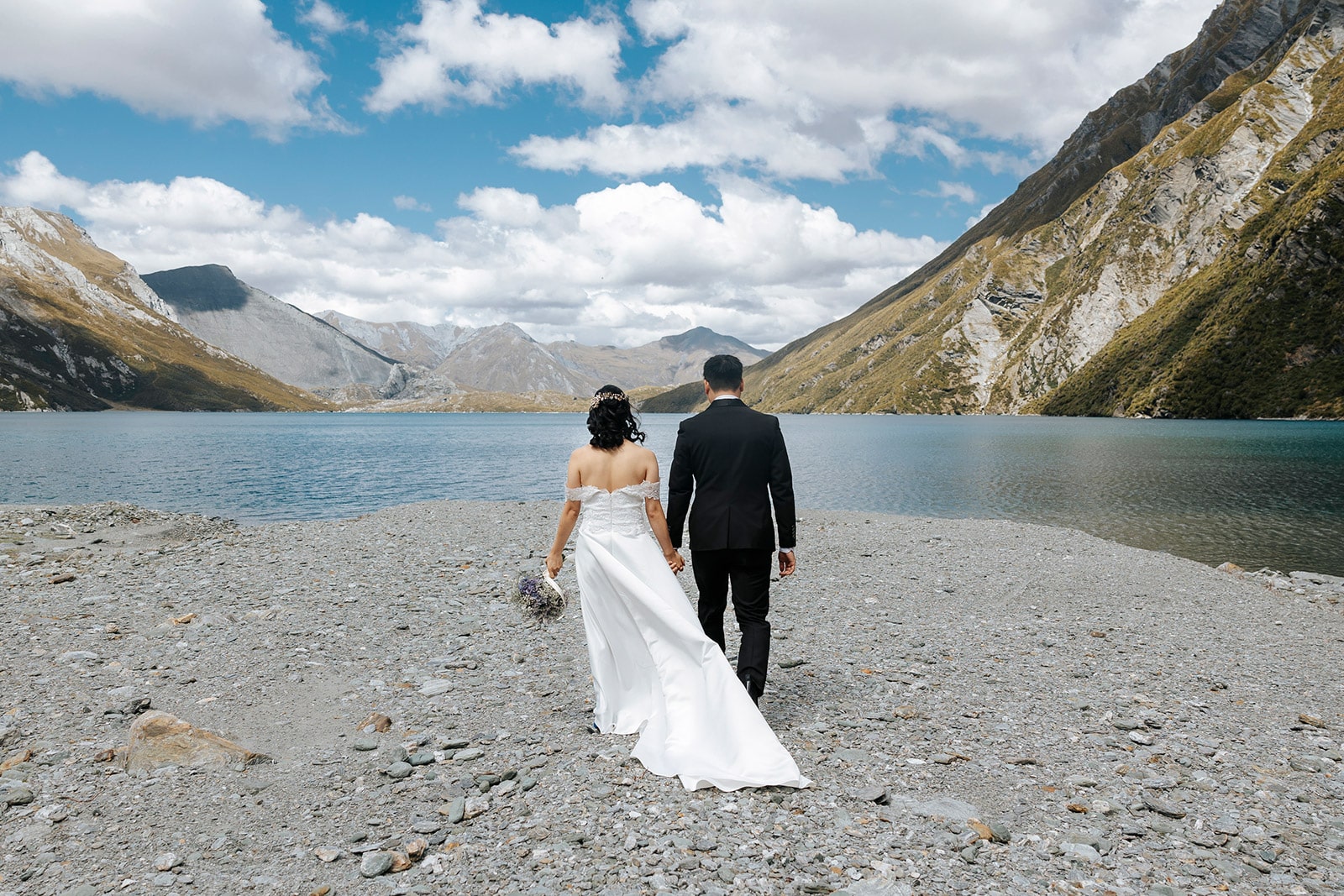 Heli Wedding at Lochnagar in Queenstown, bride and groom with lake in the background
