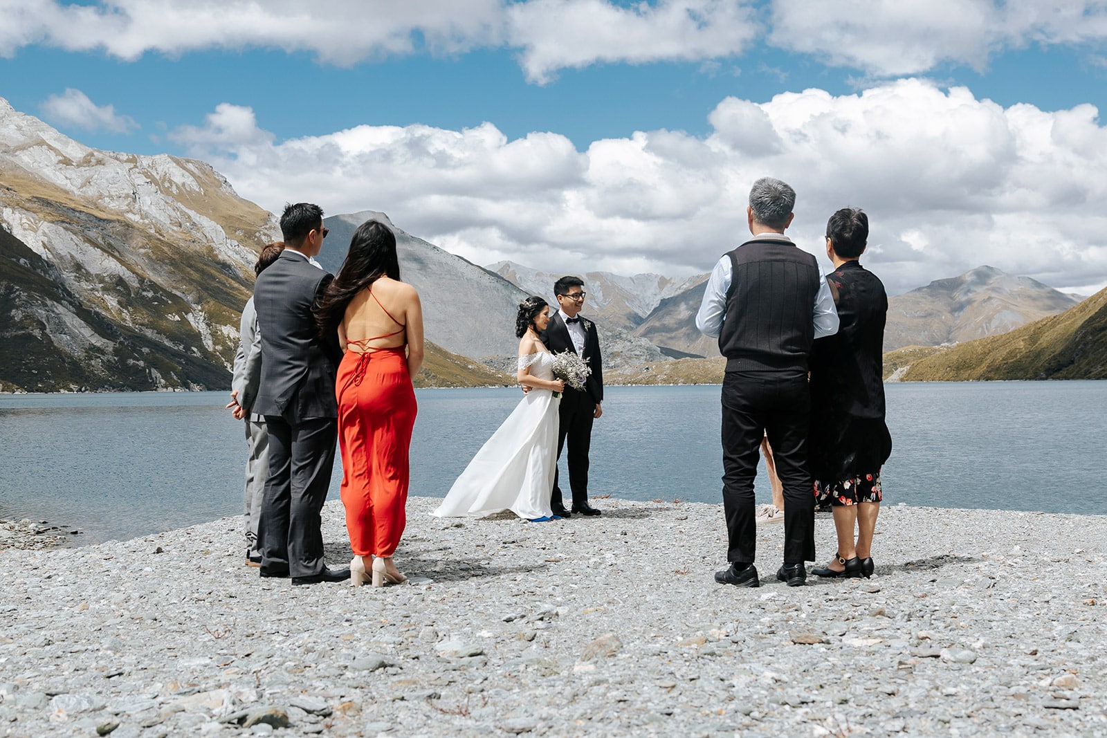 Heli Wedding at Lochnagar in Queenstown, bride and groom with lake in the background