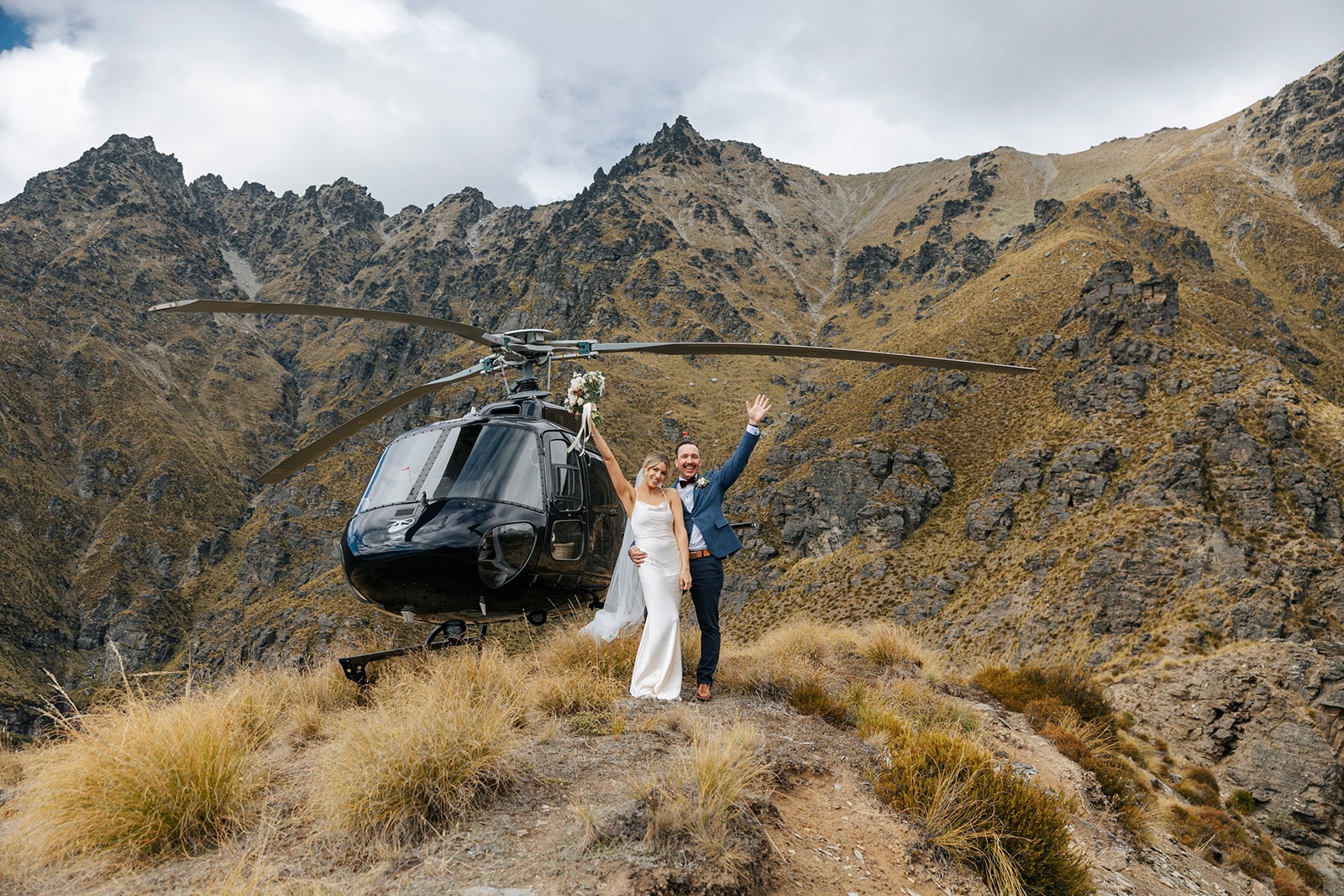 Queenstown Heli Wedding, Bride and groom with helicopter