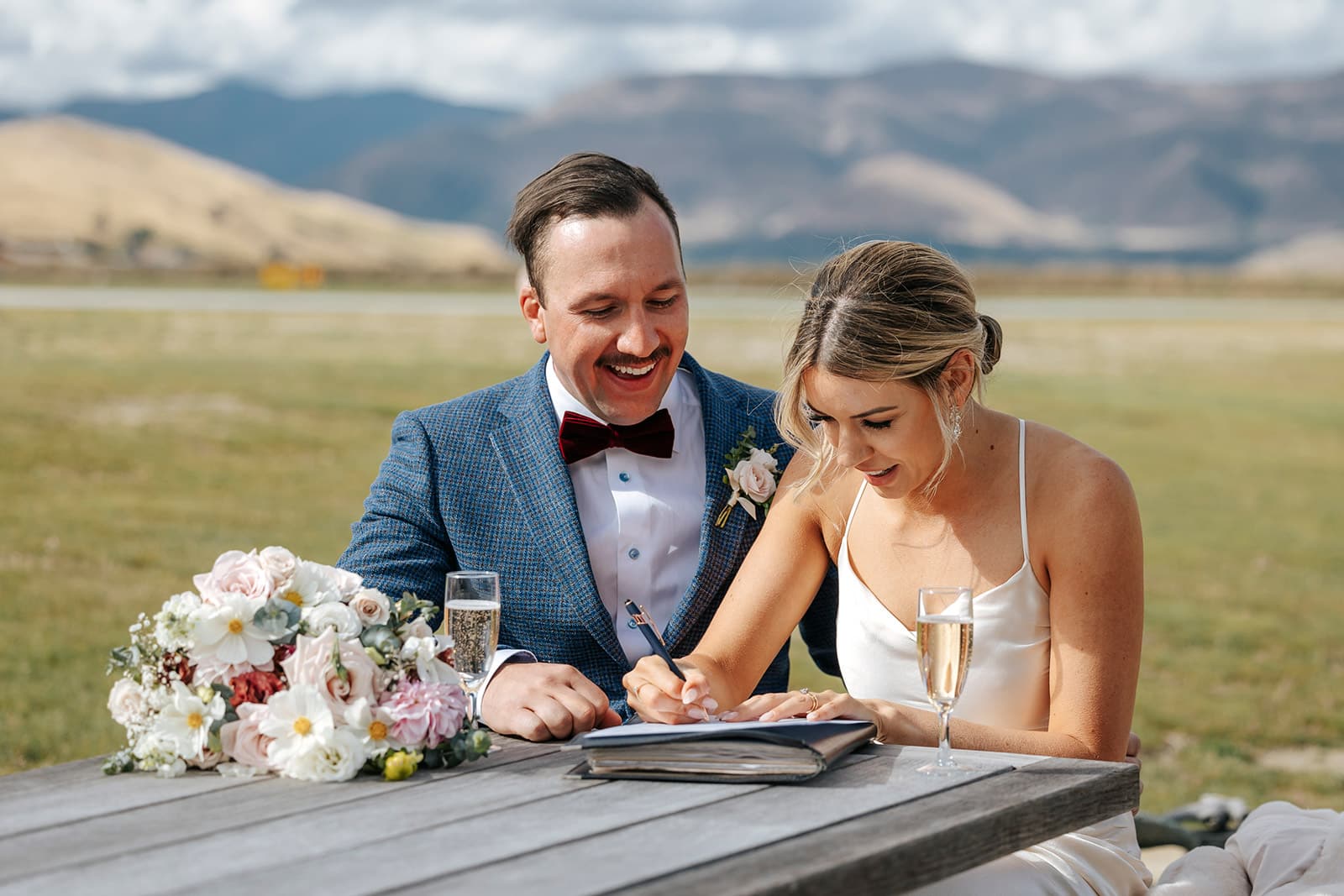 Queenstown elopement wedding, close up of bride and groom signing licence