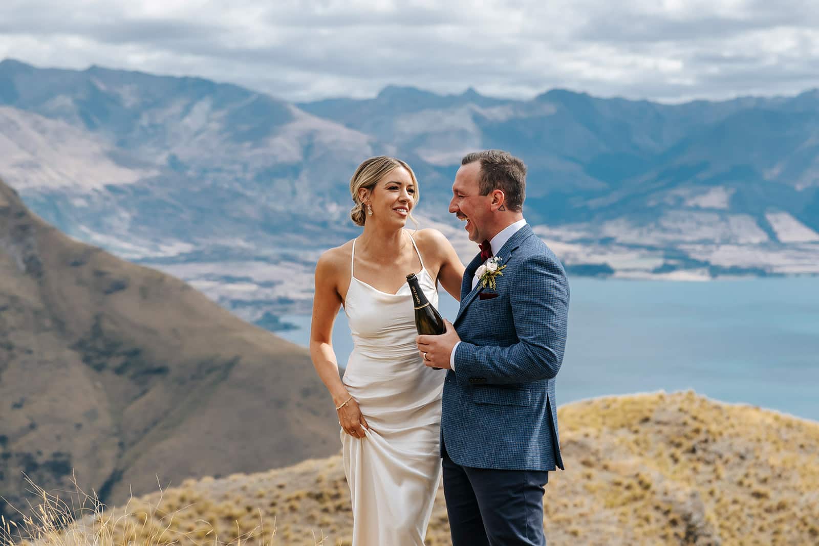 Heli Wedding on Cecil Peak in Queenstown New Zealand with bottle of champagne