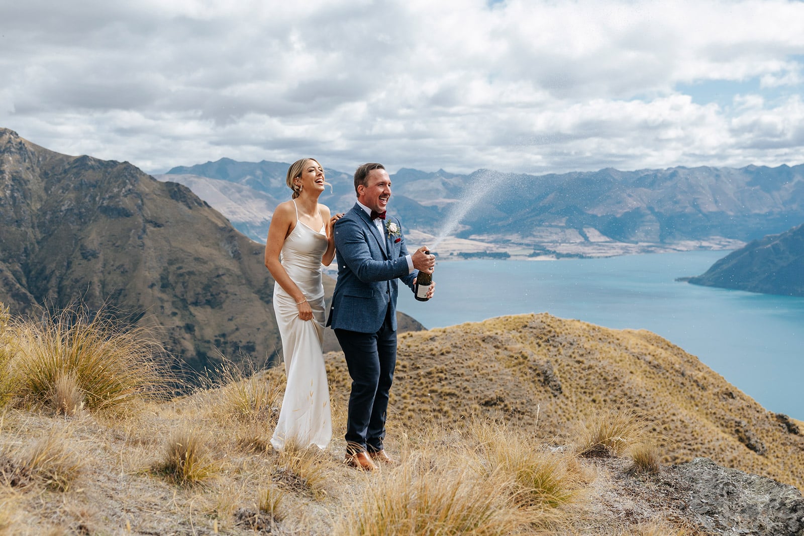 Heli Wedding on Cecil Peak in Queenstown New Zealand with bottle of champagne